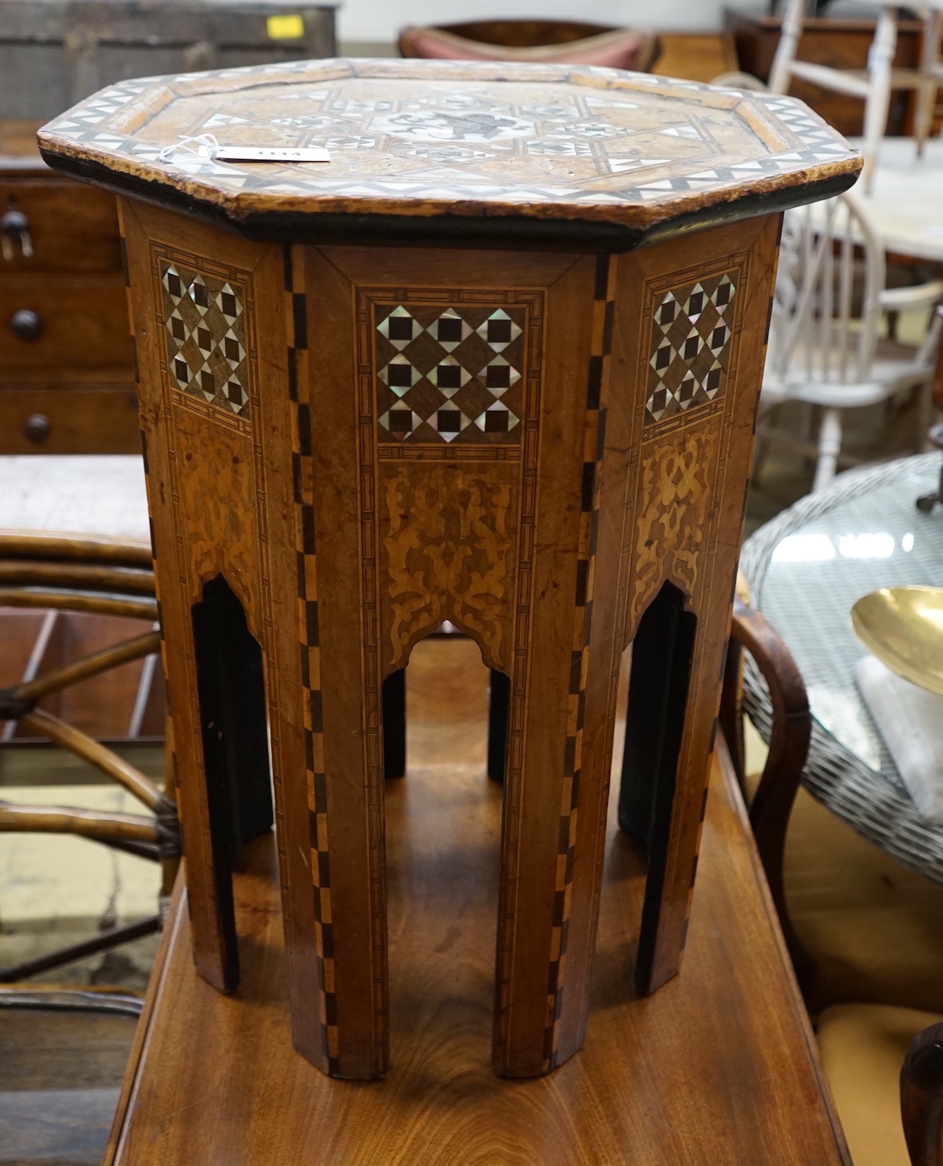 A Moorish octagonal mother of pearl inlaid centre table, width 46cm, height 62cm